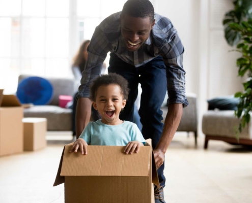 dad & son playing in boxes